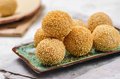 Crispy sweet rice balls with sesame filing