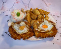 Varkenschnitzel met eiren
